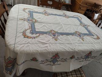 Large vintage embroidered tablecloth. Has a very very tiny slit in last pic.