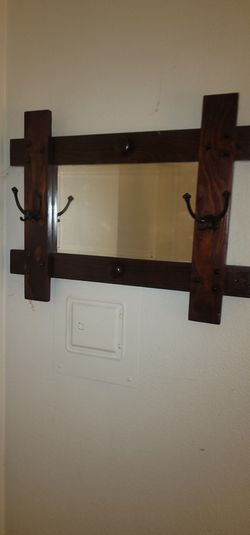 Mirror with coat racks