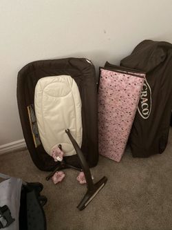 Graco pink/brown floral playpin with changing table