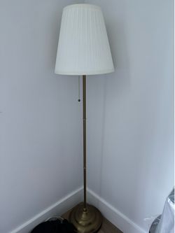 Ikea - Set of 2 elegant floor lamps with pleated white shades and brass/gold-tone finish