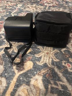 Polaroid camera with bag