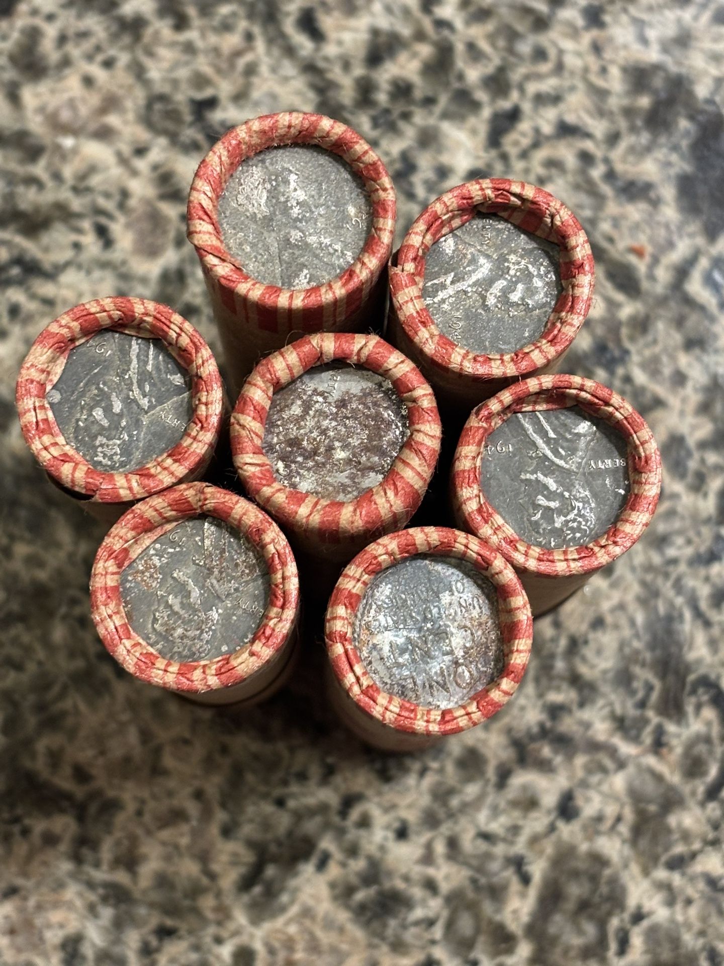 One Roll Of Wheat Pennies With An Exposed Steely