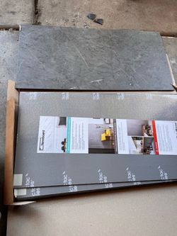 Renoboard wall panels or similar display materials, likely intended for renovation or signage.