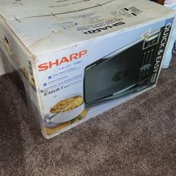 NEW NEVER OPENED Microwave 
