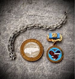 Silver cups, bracelet, coin, medal
