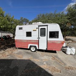 NEEDS MAJOR WORK Red And White Pull Behind Camper 