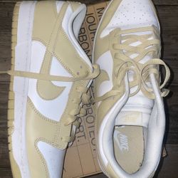  Nike Dunk Low in the "Team Gold" colorway. 