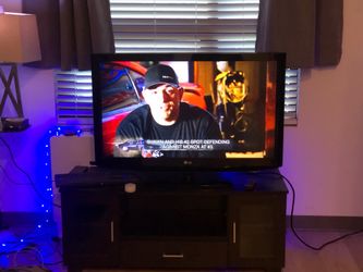 LG 42” flat screen tv and tv stand/entertainment