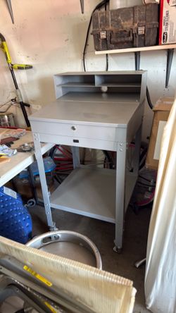 Tall metal stand with drawer