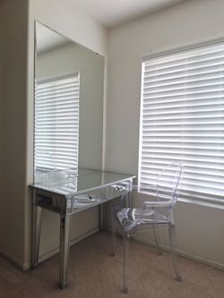 Vanity with a ghost chair.