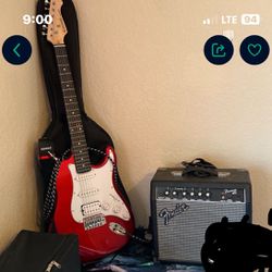 Guitar And Fender Amp With Case And Cords 