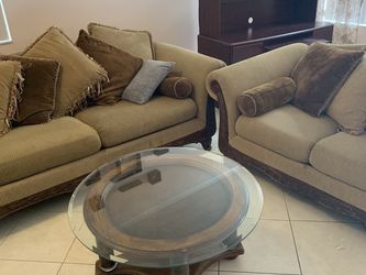 Two beautiful couches with table.