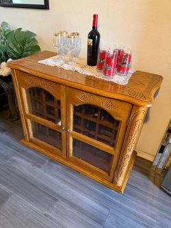 Oak wine cabinet, sturdy carved grape designs