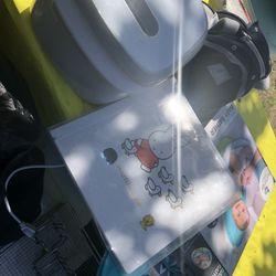 A Baby Sterilizer Machine With Baby Picture Album