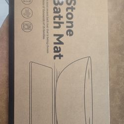 Stone bath mat.  White marbled