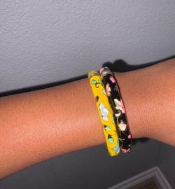 Yellow and black floral decorated bangles