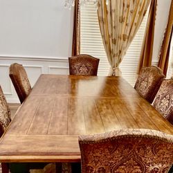 Solid wood dinning table with extender . Ashley