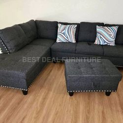 New gray sectional couch with cup holders and ottoman