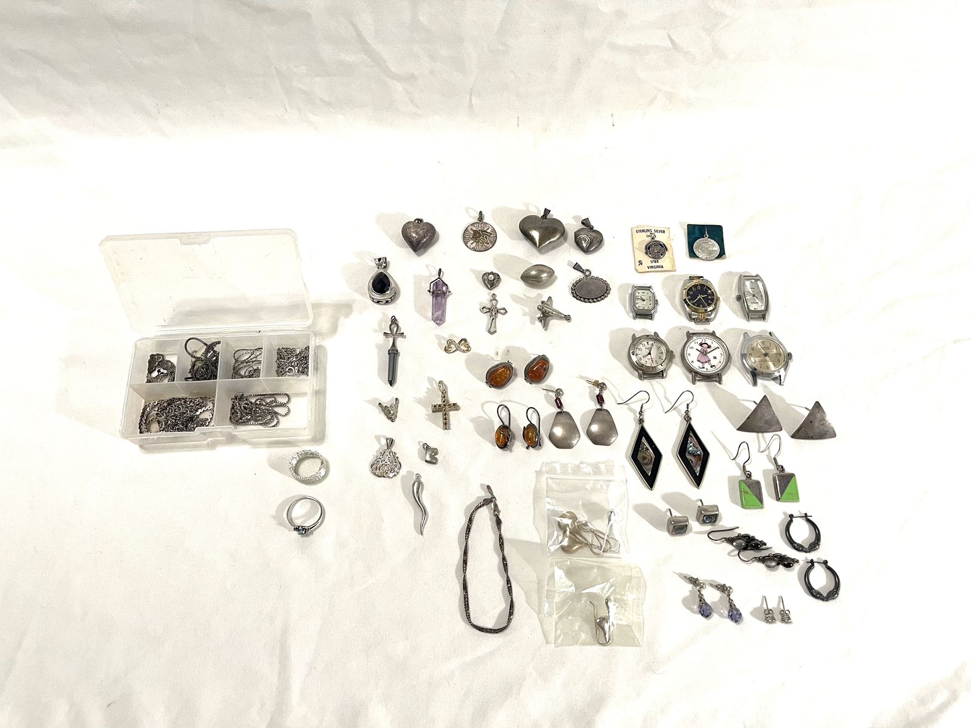 Huge Collection Of Vintage Solid, Sterling Silver Necklaces, Necklace Pendants, Earrings, Rings & Ladies Watches. There is one wind up automatic.