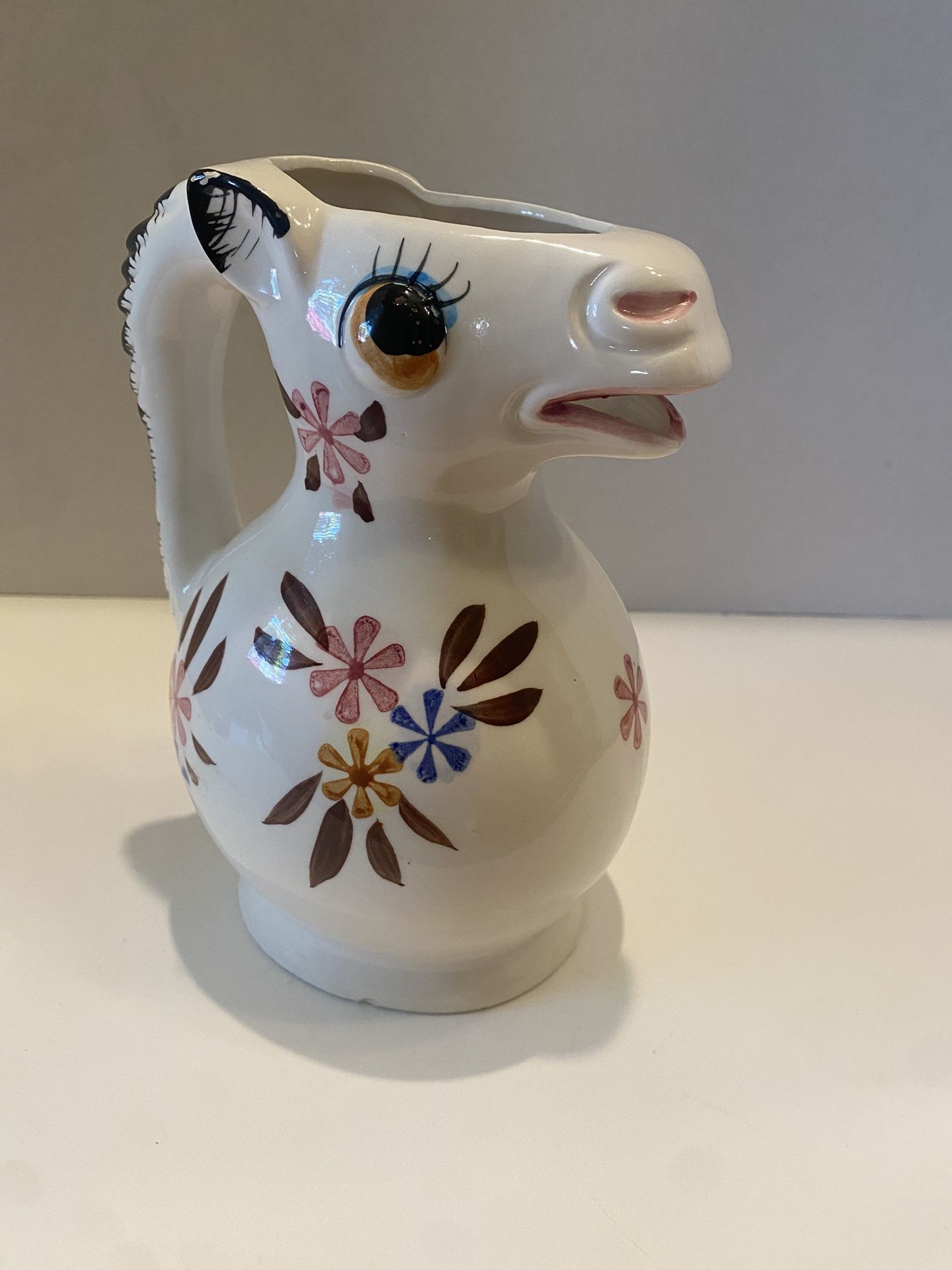 Vintage ceramic white horse pitcher / vase with flower design. Gorgeous! 7.5 inches tall x6 across.