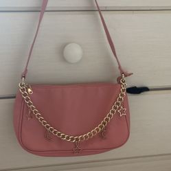 pink shoulder bag with charms
