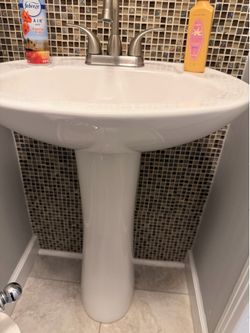 Used glacier bay toilet and pedestal sink