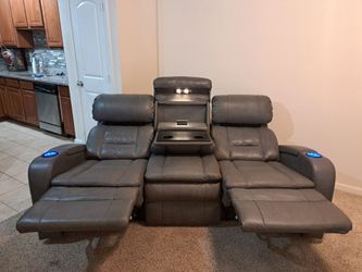 Gray power reclining sofa and loveseat