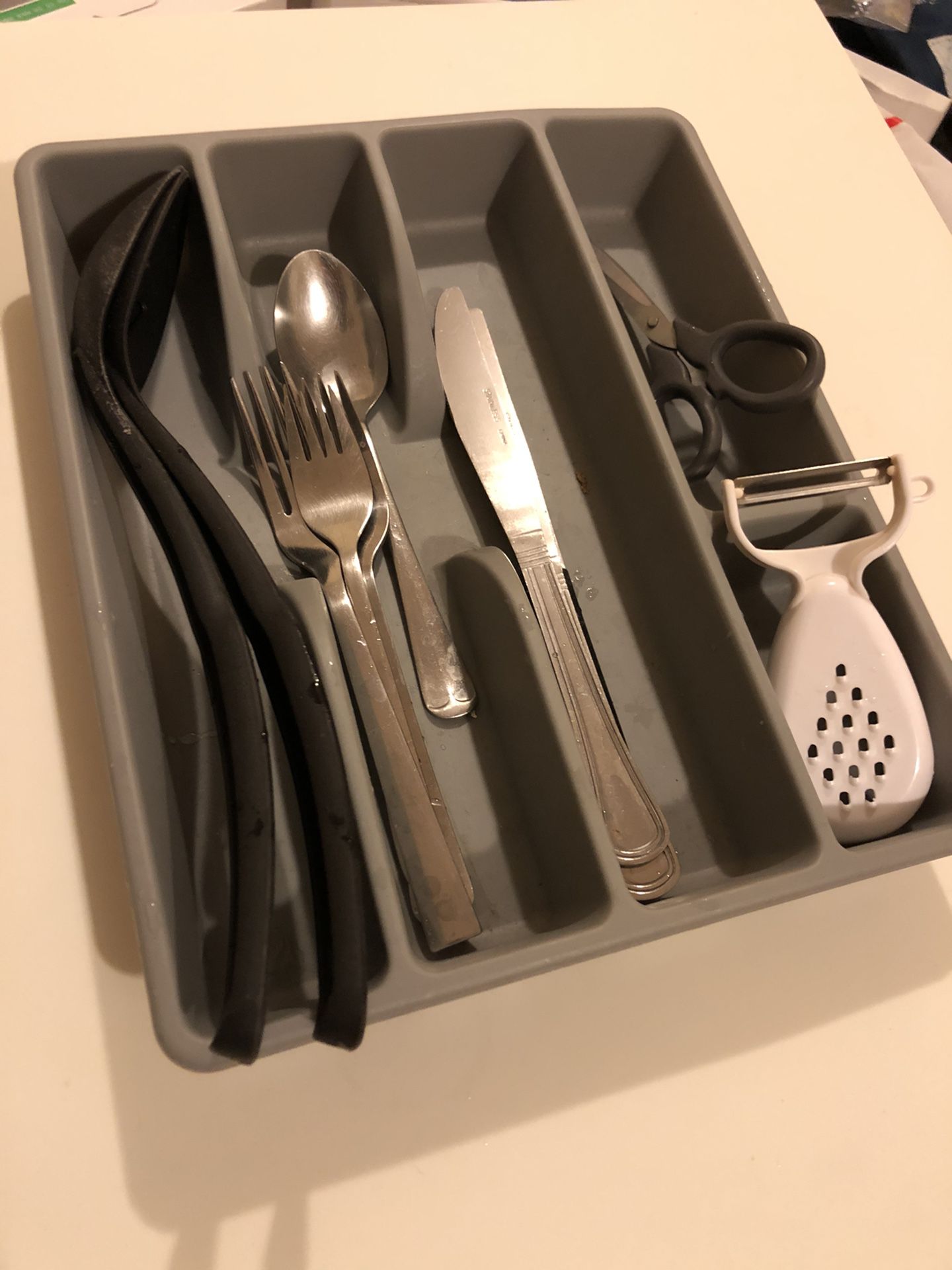 Utensils (3 forks, 3 knife, a spoon, scissor and peeler and 2 new pairs of long and small chopsticks) with utensils tray