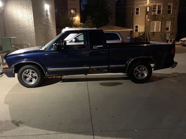 2000 Chevy S10 extended cab truck with third door behind driver’s door