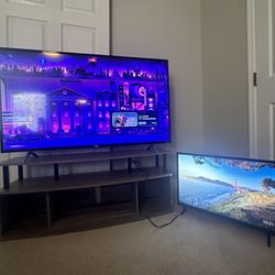 2 Smart TVs With A TV Stand