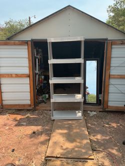 5-Tier Plastic Shelving Unit it’s 72 inches tall 30 inches wide and 14 inches deep