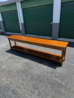 Long Narrow Wooden Console Table Piece of furniture from W.R. Dallas Furniture Studios.