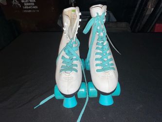 white and teal C7skates quad roller skates