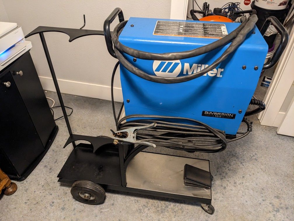 Miller Diversion 165 Tig welder with cart and foot peda. Works great no
