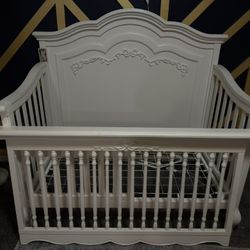 Evolur Aurora Crib with toddler bed conversion and Newton Original Mattress. 