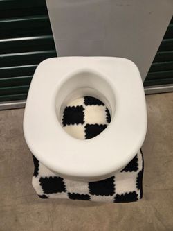 White Toilet with Raised Seat