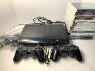 PS3 super slim 250gb console 1 camera 2 controllers 14 games and remote