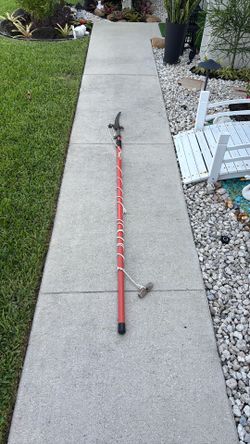 7 -13ft. Fiskar Extendable pruner and poke saw.