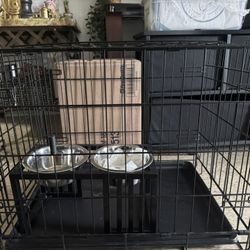 dog cage almost new with bowls