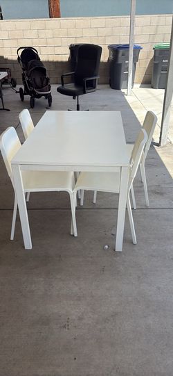 Table and 4 chairs(29x49)