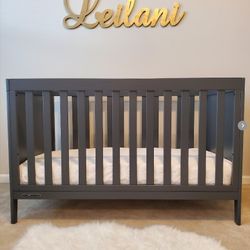 New Delta Children Gray Baby Bed