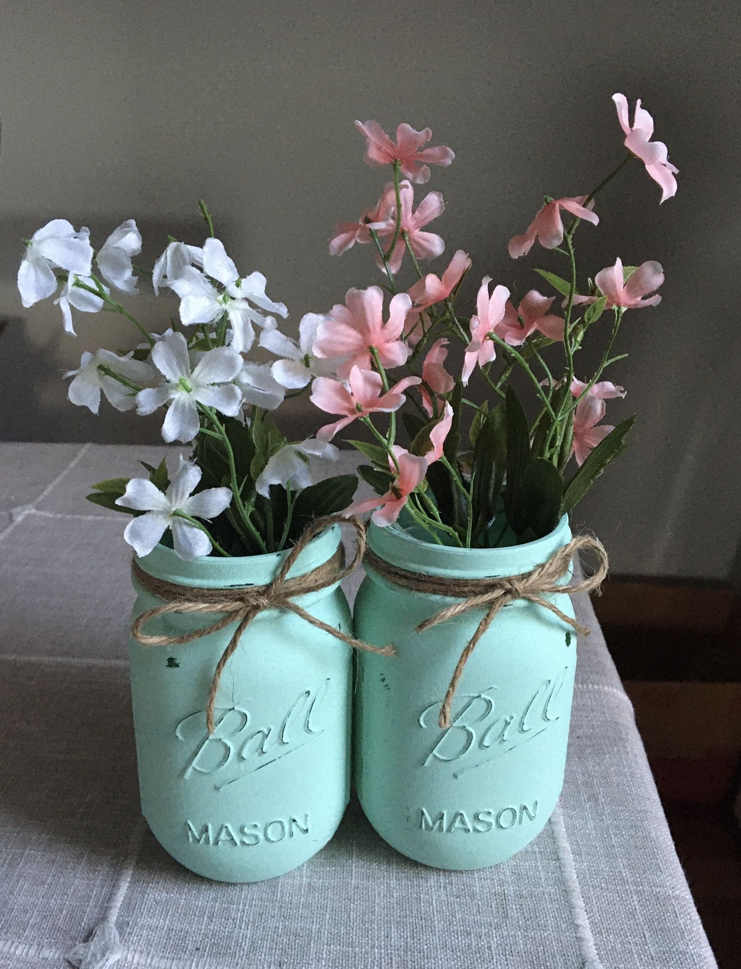 Distressed mason jar vases with silk flowers $10 for both