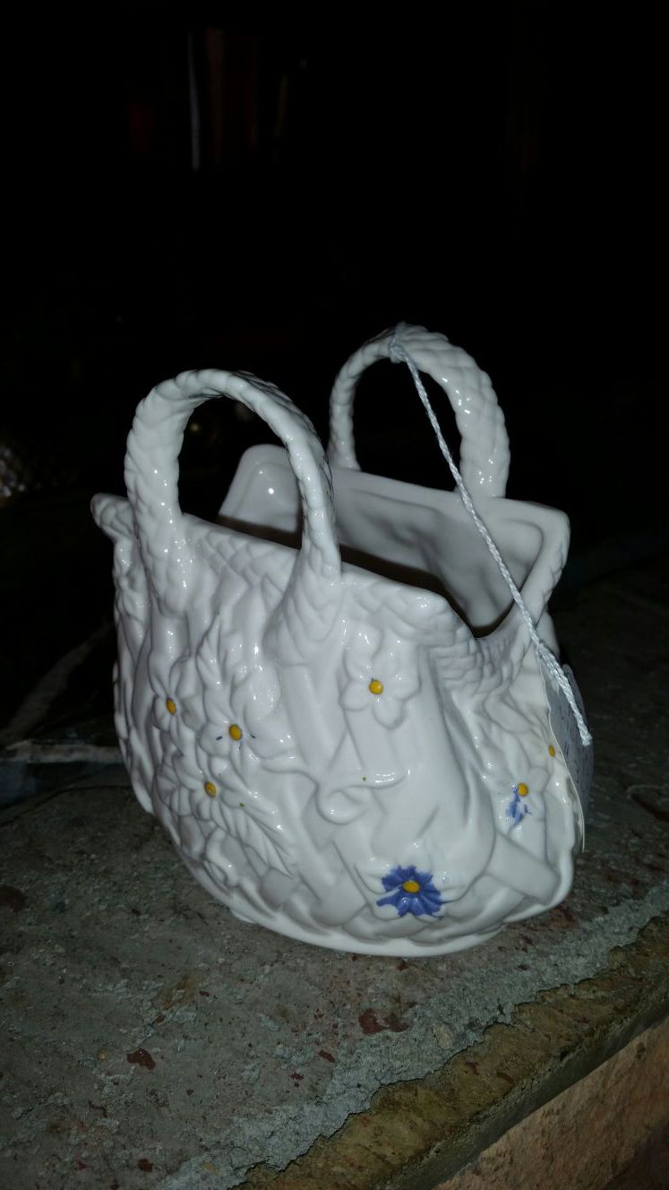 Cute little porcelain basket purse could be used for flowers or makeup or decoration excellent condition approximately 5 inches tall