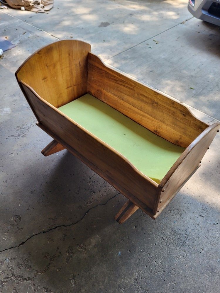 Beautiful wood crafted baby/doll cradle.