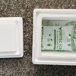 Five small Vortec ice packs and a small Styrofoam cooler. 