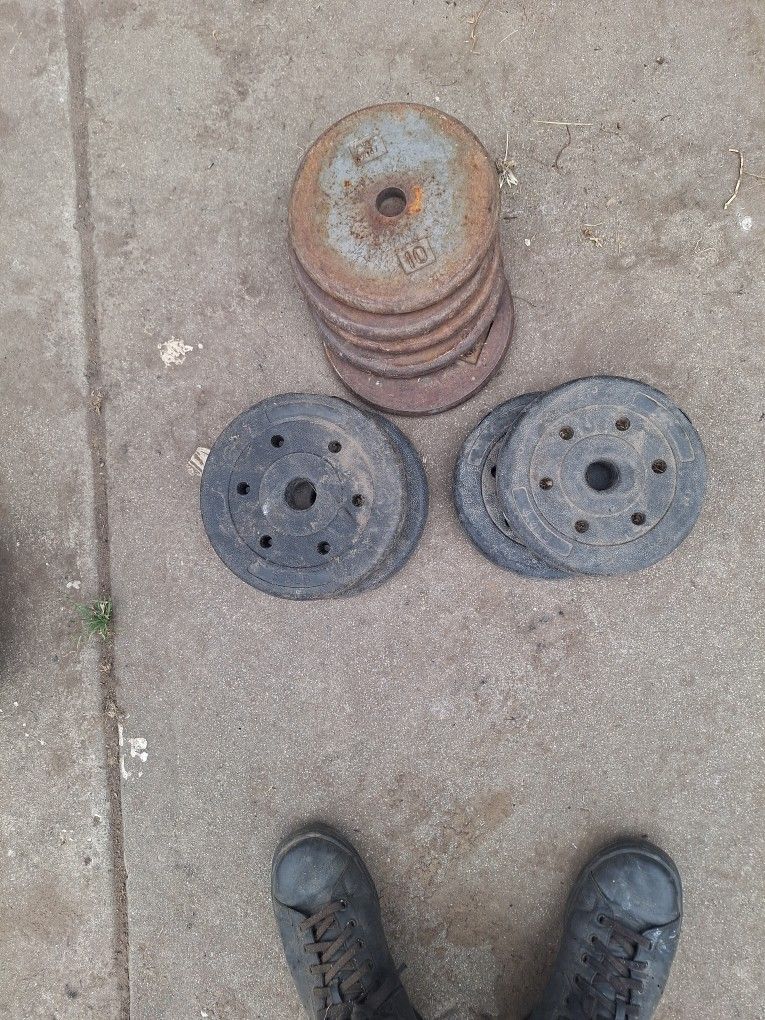 Find metal ten pound One pair of five pounds add another pair of four point four pounds