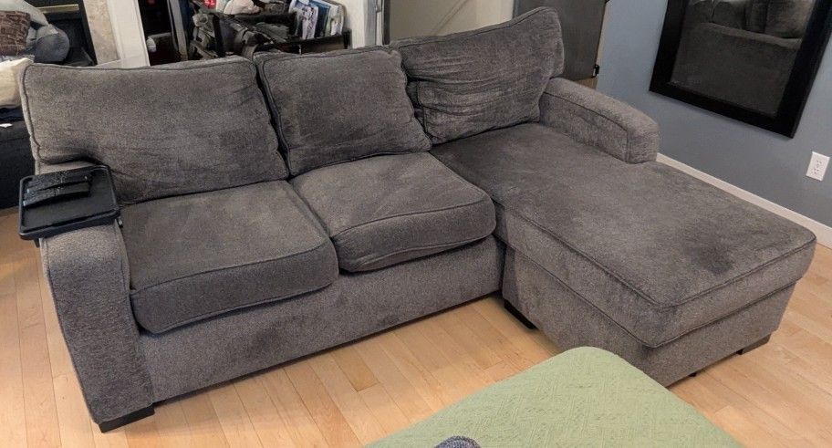 Free used L-shaped couch with built-in storage