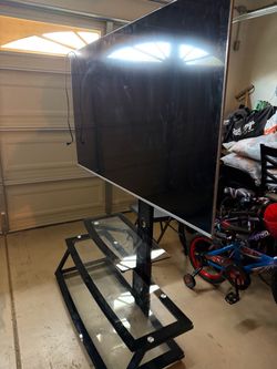 Large Vizio Flat Screen TV with Glass TV Stand
