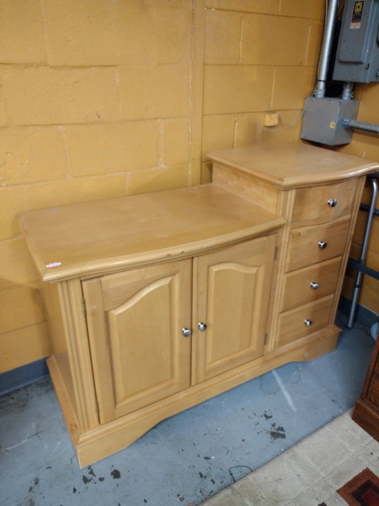 Blonde wood multiple compartment changing table