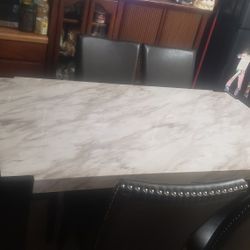 Dining table and 6 leather chairs, very clean, for sale
